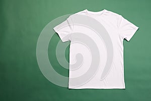 White t shirt and copy space on green background