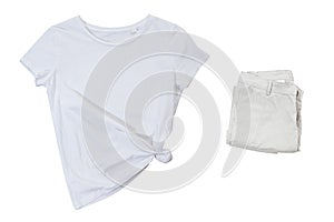 White t-shirt and folded pants isolated on white background top view, tshirt and pants