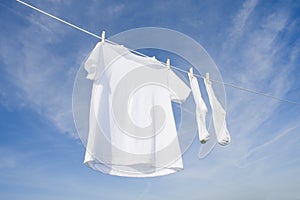 White T-Shirt and socks on Blue Sky