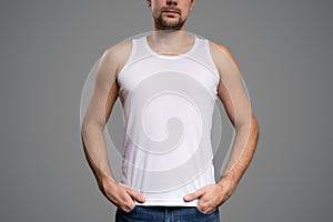 White t-shirt on a young man template. Gray background.