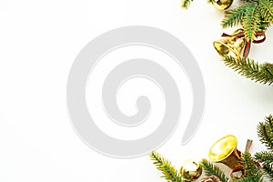 White table with Christmas decoration including pine branches and golden stuffs. Merry Christmas and happy new year concept. Top