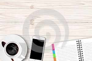 White table with coffee cup notebook and Smartphone