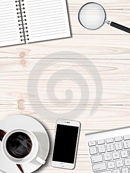 White table with coffee cup notebook and Smartphone