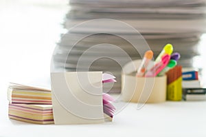 On a white table colorful block for notes