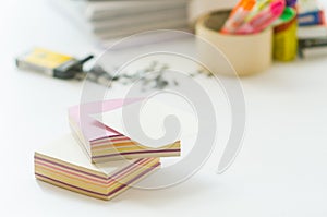 On a white table colorful block for notes