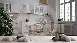 White table, desk or shelf with five soft white pillows in the shape of stars or flowers, over blurred retro dining room, kitchen