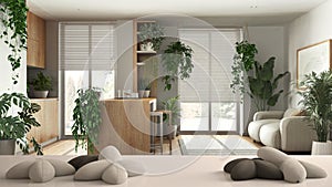 White table, desk or shelf with five soft white pillows in the shape of stars or flowers, over kitchen with island and living room