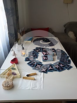 White table filled with different objects for therapy  healing  readings