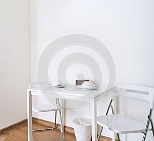 White table with folding chairs set in kitchen room mock up, Modern room design concept for apartment room interior decoration.