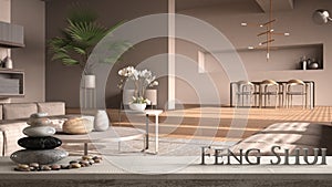 White table shelf with pebble balance and 3d letters making the word feng shui over lounge with dining room in beige tones with