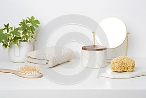 White table top in bathroom with bathing accessories and toiletries