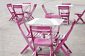 White tables and pink chairs