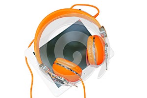 White tablet computer with orange headphones isolated on white