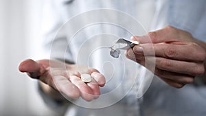 White tablet lying on female hand, medicine and health care, pharmaceuticals