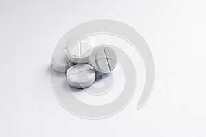 White tablets on a white background