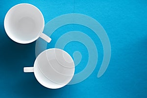 White tableware crockery set, empty cup on blue flatlay background