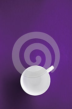 White tableware crockery set, empty cup on purple flatlay background