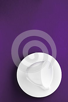 White tableware crockery set, empty cup on purple flatlay background