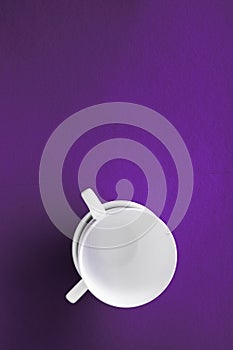 White tableware crockery set, empty cup on purple flatlay background