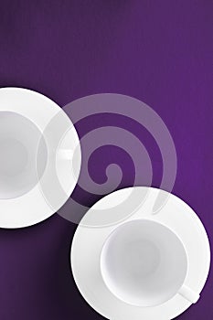 White tableware crockery set, empty cup on purple flatlay background