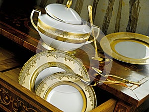 White tableware set with gold trim