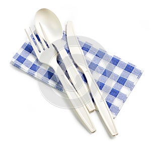 White take away spoon and fork on paper napkin