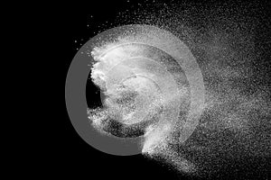 White talcum powder explosion on black background.