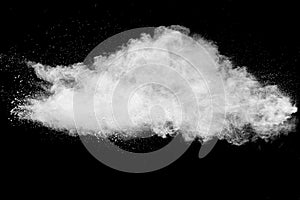 White talcume powder explosion on black background. White dust particles splash