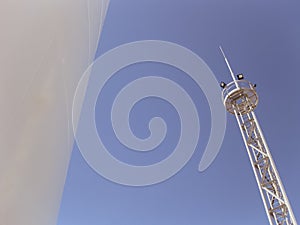 White tank and tower lighting on the sky background