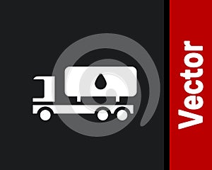 White Tanker truck icon isolated on black background. Petroleum tanker, petrol truck, cistern, oil trailer. Vector