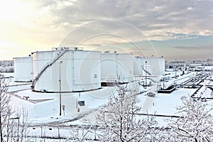 White tanks in tank farm with snow in winter