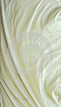 White tarpaulin with swirls and corner creases