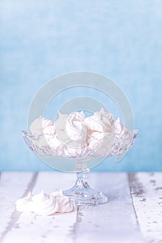 White tasty Meringe with blue background