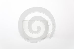 White tea cup isolated on white background side view with handle