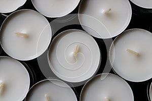 White tea light candles with black background - Image