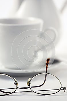 White Tea Set and Male Eyeglasses on white background.