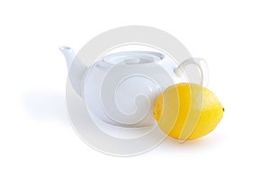 White teakettle and lemon photo