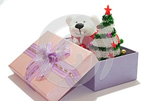 White teddy bear with christmas tree