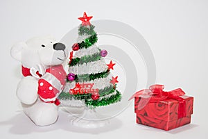 White teddy bear with christmas tree