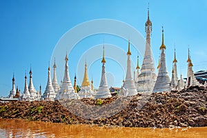 White temples near water body in Myanmar