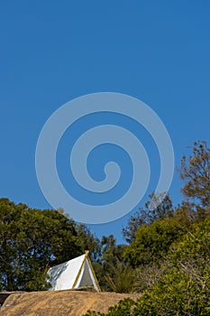 White tent on a hill