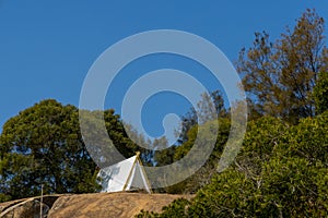 White tent on a hill