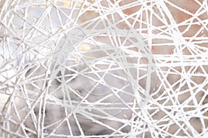 White texture background, fragment of white thread round surface