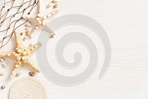 White textured wooden surface decorated with sea shells