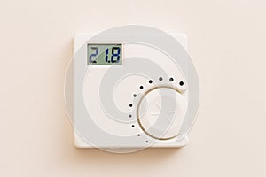 White thermostat on wall