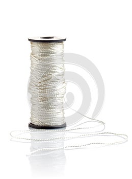 White thread on reel
