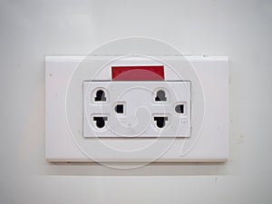 White three electric socket on wall background