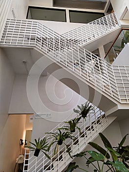 The white three level indoor stairs
