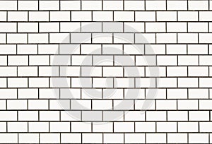 White tiled wall background with rectangular tiles that look like bricks.