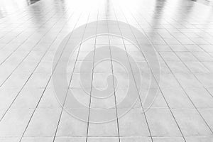 White Tiles marble floor background/White tiles floor texture office With the morning sun, the windows reflect the reflection.